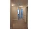 Hallway with carpet and access to multiple bedrooms at 727 Putney Hill Rd, Zebulon, NC 27597