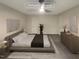 Virtually staged main bedroom with large bed and dresser at 5300 Old Forge Cir, Raleigh, NC 27609