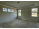 Spacious bedroom with large windows and hardwood floors at 1504 Maelyn Way, Fuquay Varina, NC 27526