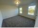 Spacious bedroom featuring wall-to-wall carpeting and large windows at 1504 Maelyn Way, Fuquay Varina, NC 27526