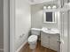 Small bathroom with white vanity and toilet at 104 Deerwalk Ct, Cary, NC 27513