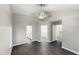 Spacious bedroom with wood-look floors and access to bathroom and hallway at 104 Deerwalk Ct, Cary, NC 27513