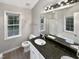 Bathroom with granite countertop and double vanity at 104 Deerwalk Ct, Cary, NC 27513