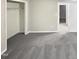 Spacious bedroom with neutral carpeting and large closet at 104 Deerwalk Ct, Cary, NC 27513