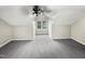Large bedroom with grey carpet and ceiling fan at 104 Deerwalk Ct, Cary, NC 27513
