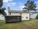 House exterior showcasing a screened porch and backyard at 104 Deerwalk Ct, Cary, NC 27513