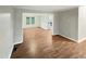 Hardwood floor living room with view into dining area at 104 Deerwalk Ct, Cary, NC 27513