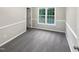 Well-lit bedroom with neutral carpeting and window at 104 Deerwalk Ct, Cary, NC 27513