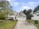 Two-story house with attached garage and landscaped yard at 104 Deerwalk Ct, Cary, NC 27513