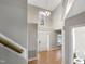 Two-story entryway with hardwood floors and elegant chandelier at 104 Deerwalk Ct, Cary, NC 27513