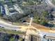 Aerial view of townhomes, pool, and new road construction at 1229 Tulip St, Clayton, NC 27520