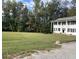 White two-story house with columns, spacious yard at 1229 Tulip St, Clayton, NC 27520