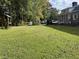 Spacious backyard with playset, shed, and vehicles at 1229 Tulip St, Clayton, NC 27520