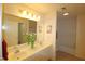 Double vanity bathroom with a large mirror and tile flooring at 11370 Clubhaven Pl # 103, Raleigh, NC 27617