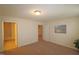Bright bedroom with carpet, double window and access to bathroom at 11370 Clubhaven Pl # 103, Raleigh, NC 27617