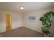 Bright bedroom with carpeting, double windows, and coastal art at 11370 Clubhaven Pl # 103, Raleigh, NC 27617