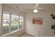 Cozy bedroom with large window and ceiling fan at 11370 Clubhaven Pl # 103, Raleigh, NC 27617
