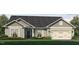 Exterior view of a beautiful two-story home with a two-car garage and landscaping at 215 Merrifield Ln, Garner, NC 27529