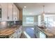 Modern kitchen with granite countertops, custom cabinetry, and a large island at 1056 Fairhaven Dr # 97, Mebane, NC 27302