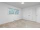 Bright bedroom with neutral carpeting and double window at 2509 Mckinney St, Burlington, NC 27217