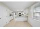 Kitchen with white cabinets, granite countertops, and stainless steel appliances at 1004 Hardimont Rd, Raleigh, NC 27609