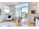 Open living area with white sofa and access to balcony at 515 N Mangum St # 51, Durham, NC 27701