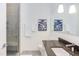 Clean bathroom with dark countertop and glass shower at 515 N Mangum St # 51, Durham, NC 27701