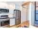 Modern kitchen with stainless steel appliances and white cabinets at 515 N Mangum St # 51, Durham, NC 27701