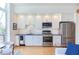 Modern kitchen with stainless steel appliances and white cabinets at 515 N Mangum St # 51, Durham, NC 27701