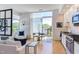 Open living area with white sofa and access to balcony at 515 N Mangum St # 51, Durham, NC 27701