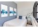 Cozy bedroom with blue accents and city view art at 515 N Mangum St # 51, Durham, NC 27701
