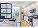 Modern kitchen with stainless steel appliances and breakfast bar at 515 N Mangum St # 51, Durham, NC 27701