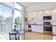 Modern kitchen with stainless steel appliances and white cabinets at 515 N Mangum St # 51, Durham, NC 27701