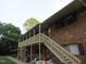Brick apartment building with a stairway and covered balconies at 130 S Estes Dr # B-11, Chapel Hill, NC 27514