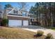 Two-story brick home with double garage and landscaped yard at 671 Legend Oaks Dr, Chapel Hill, NC 27517