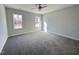 Spacious bedroom with neutral carpeting and ample natural light at 49 Lupin Dr, Smithfield, NC 27577