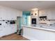 White kitchen with black appliances and tile countertops at 110 W Parker St, Smithfield, NC 27577