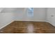 Bright bedroom with wood-look floors and ample natural light at 2809 Kempsford Pl, Raleigh, NC 27604