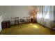 Simple living room with wood furniture and yellow carpeting at 108 Gulf Dr, Dunn, NC 28334