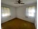 Spacious bedroom with neutral carpeting and two windows at 108 Gulf Dr, Dunn, NC 28334