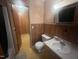 Bathroom with shower/tub combo and wood-paneled walls at 108 Gulf Dr, Dunn, NC 28334