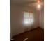 Small bedroom with a window featuring sheer curtains at 108 Gulf Dr, Dunn, NC 28334