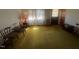 Bright living room with yellow carpet, and wood furniture at 108 Gulf Dr, Dunn, NC 28334