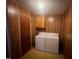 Laundry room with washer, dryer, and built-in cabinets at 108 Gulf Dr, Dunn, NC 28334