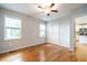 Bright bedroom with hardwood floors, double closets, and kitchen access at 116 Plainview Ave, Raleigh, NC 27604