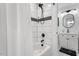 Modern bathroom with white subway tiles and black accents at 306 E Knox St, Durham, NC 27701