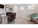 Spacious home office with a desk, chair, and a drafting table at 421 Granite Saddle Dr, Rolesville, NC 27571