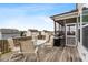 Spacious deck with seating area, grill, and screened porch overlooking neighborhood at 421 Granite Saddle Dr, Rolesville, NC 27571