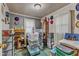 Bedroom with shelving unit and multiple storage containers at 9336 Baileywick Rd, Raleigh, NC 27615