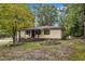 Charming ranch home nestled in a wooded setting with a spacious yard at 9336 Baileywick Rd, Raleigh, NC 27615